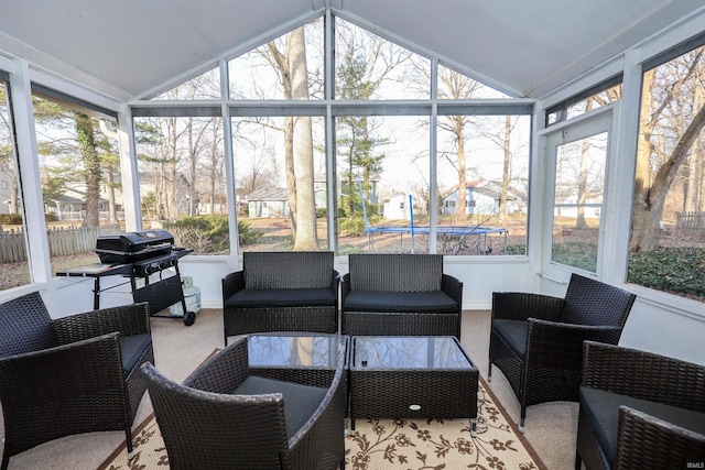 sunroom with lofted ceiling and a wealth of natural light