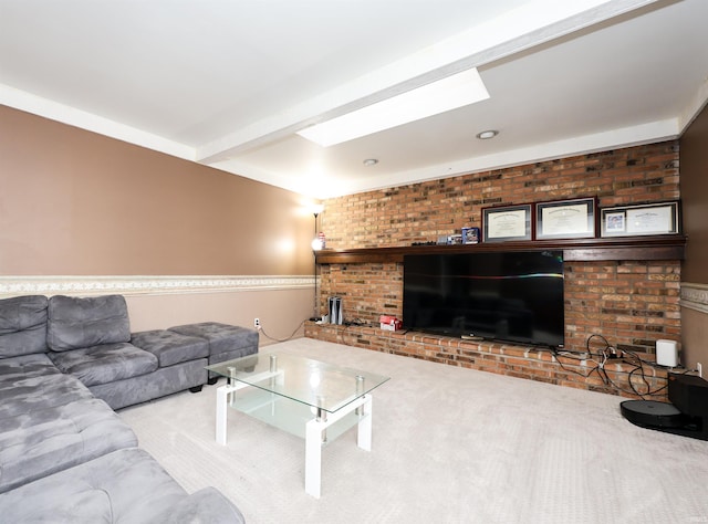 living room featuring beamed ceiling, a brick fireplace, carpet floors, and a skylight