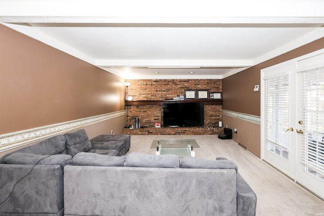 living room featuring light carpet and beamed ceiling