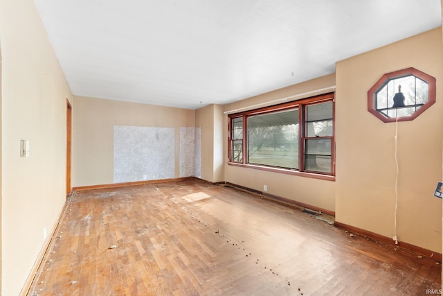 empty room with hardwood / wood-style flooring