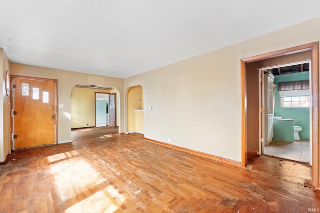 unfurnished living room with hardwood / wood-style flooring