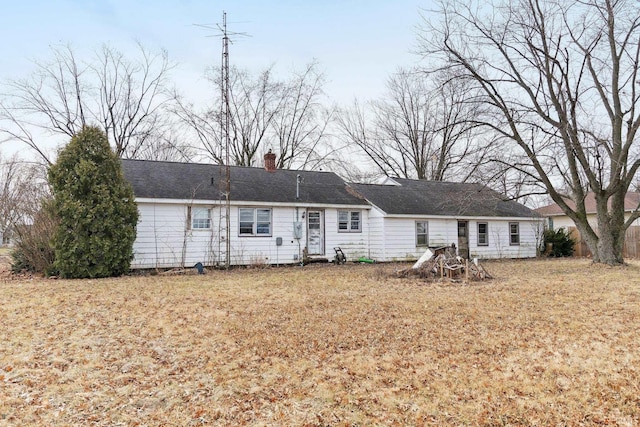 back of house with a yard