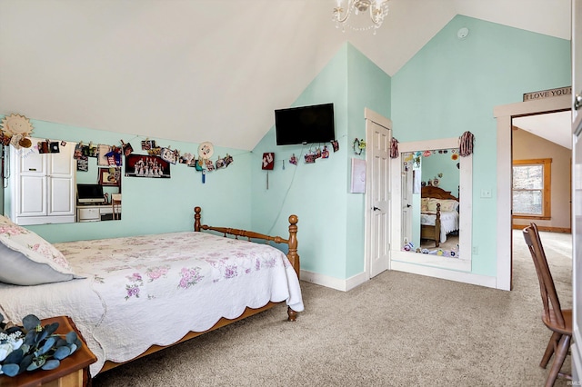 carpeted bedroom with lofted ceiling and a notable chandelier