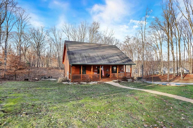 view of front of property with a porch and a front lawn