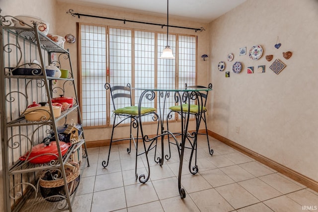 dining space featuring a healthy amount of sunlight and tile patterned flooring