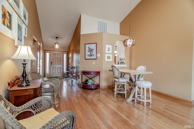 entryway featuring a high ceiling and light wood-type flooring