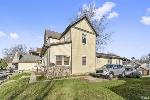 view of home's exterior featuring a yard