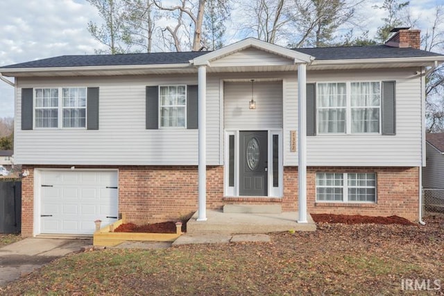 bi-level home featuring a garage