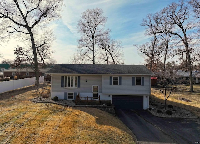 split foyer home featuring a garage