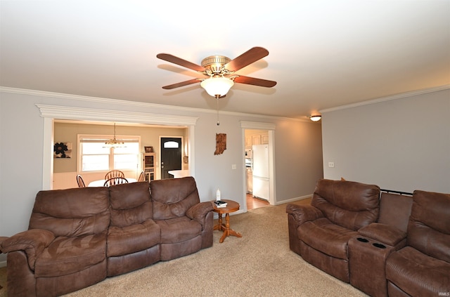 living room with crown molding, carpet, and ceiling fan