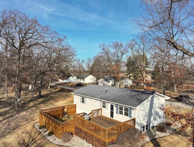 rear view of house featuring a deck