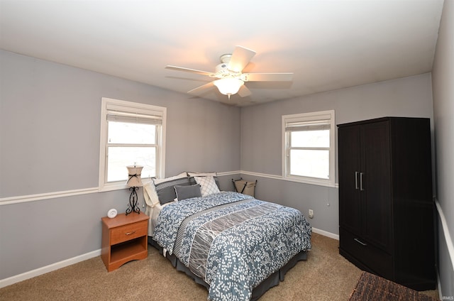 bedroom with ceiling fan and carpet