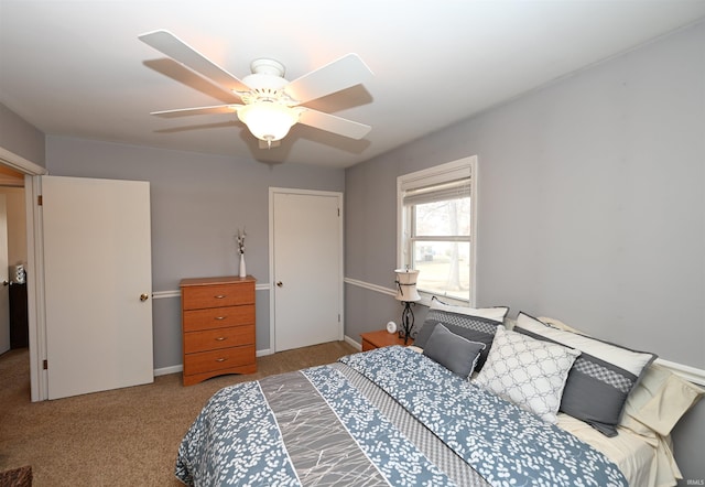 carpeted bedroom featuring ceiling fan