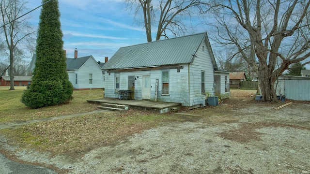 exterior space with central AC unit and a deck