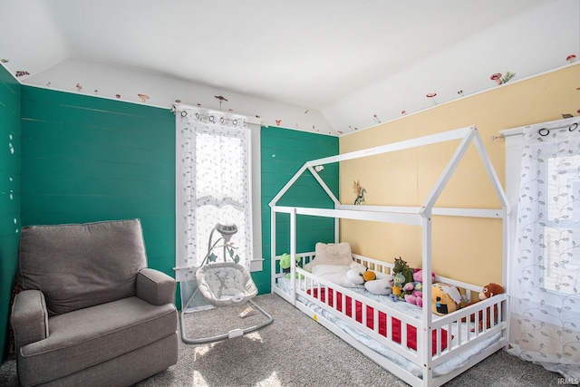 bedroom featuring lofted ceiling and carpet flooring