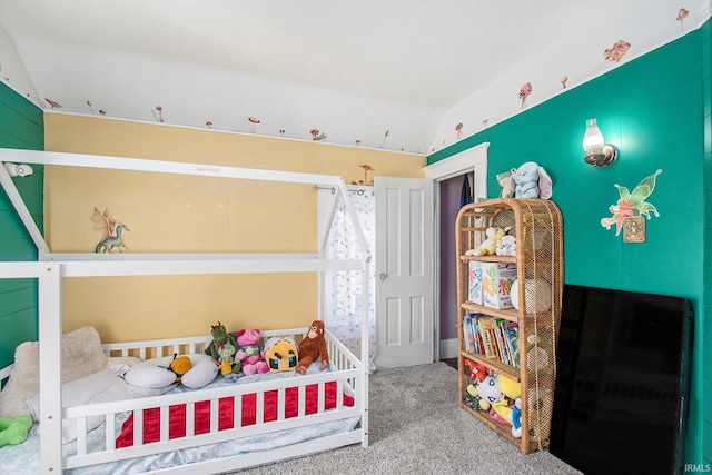 bedroom with lofted ceiling and carpet floors