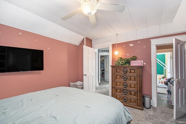 bedroom featuring carpet, lofted ceiling, and ceiling fan