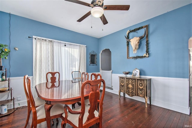 dining space featuring ceiling fan and dark hardwood / wood-style floors