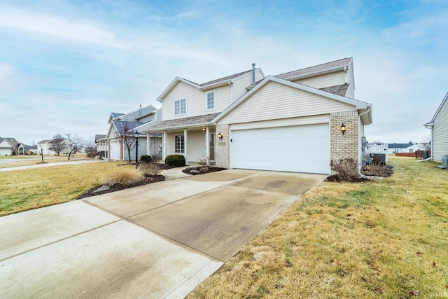 view of front property featuring a garage and a front lawn