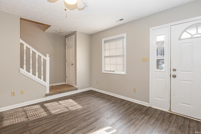 entrance foyer featuring dark wood-type flooring and ceiling fan