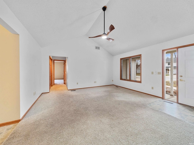 unfurnished living room featuring light carpet, ceiling fan, high vaulted ceiling, and a textured ceiling