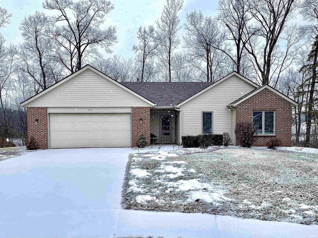 ranch-style house featuring a garage