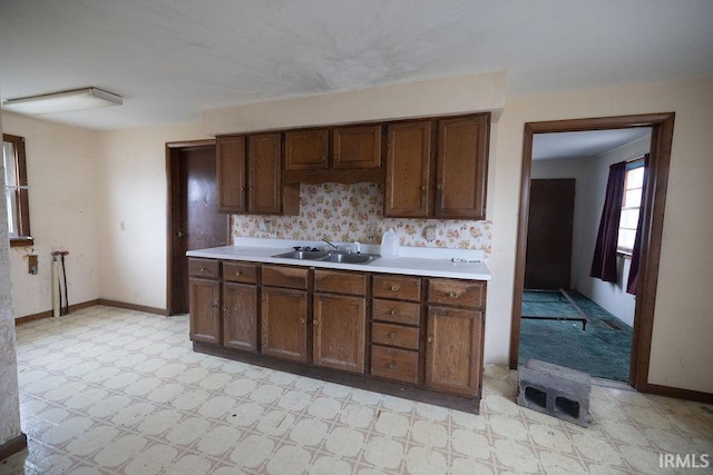 kitchen with sink and dark brown cabinets