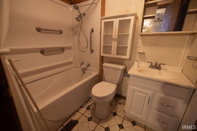 full bathroom with vanity, toilet, tiled shower / bath combo, and tile patterned flooring