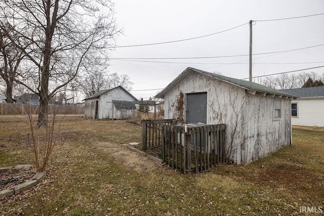 view of outdoor structure with a lawn