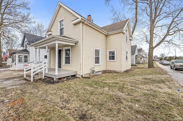 view of property exterior featuring a lawn