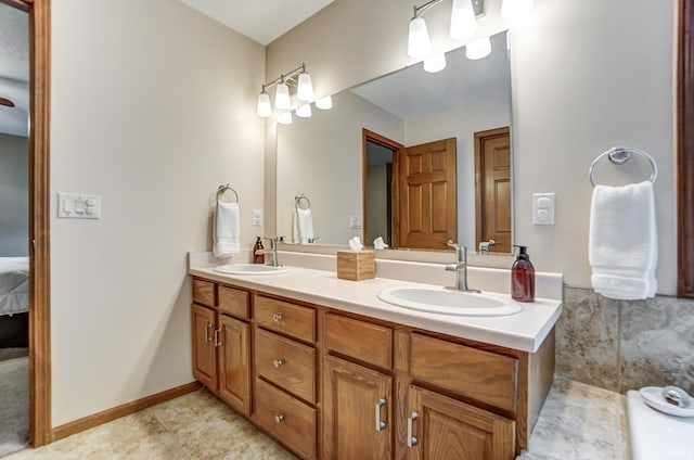 bathroom with tile patterned flooring and vanity