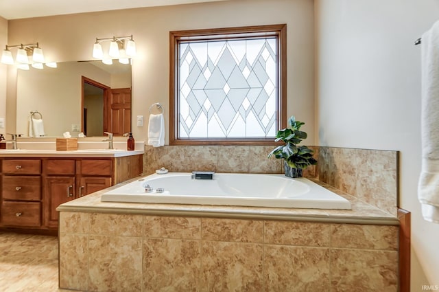 bathroom featuring vanity, tiled tub, and tile patterned floors