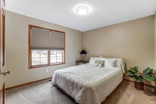 bedroom featuring light colored carpet