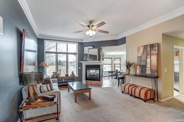 carpeted living room with ceiling fan, ornamental molding, and a multi sided fireplace