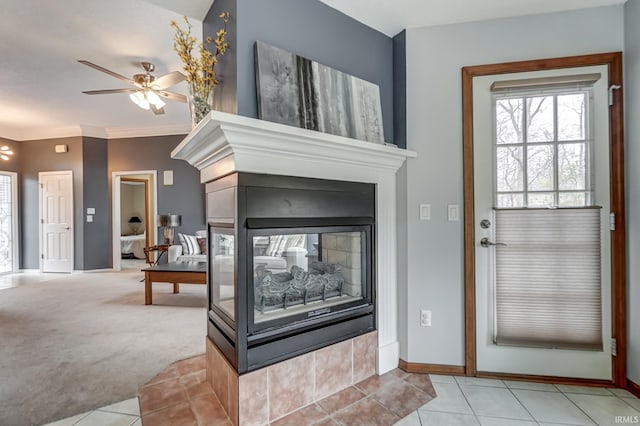 entryway featuring ceiling fan, light colored carpet, ornamental molding, and a multi sided fireplace