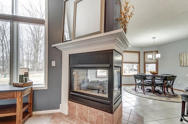 room details with a multi sided fireplace and a chandelier