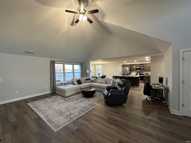 living room featuring dark wood-type flooring, ceiling fan, and high vaulted ceiling