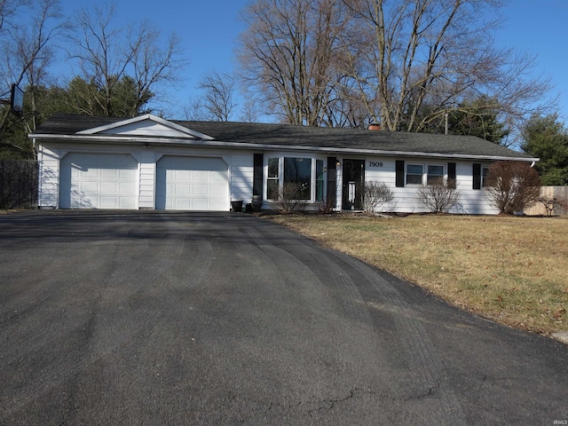 single story home with a garage and a front yard