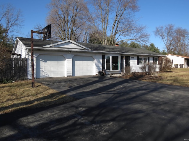 ranch-style house featuring a garage