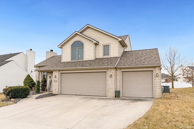 traditional-style home with central air condition unit, roof with shingles, and brick siding