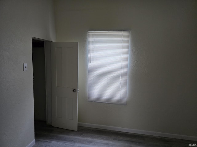 unfurnished room featuring wood-type flooring