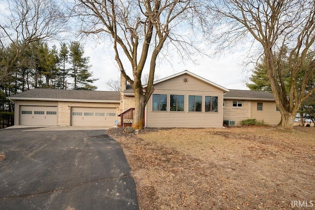 ranch-style home with a garage