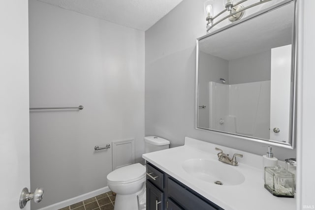 bathroom featuring tile patterned flooring, vanity, a shower, a textured ceiling, and toilet