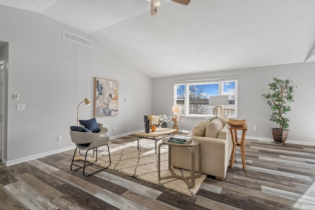 living room with vaulted ceiling, dark hardwood / wood-style floors, and ceiling fan