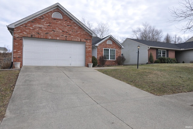 view of front facade featuring driveway, a front lawn, an attached garage, and brick siding