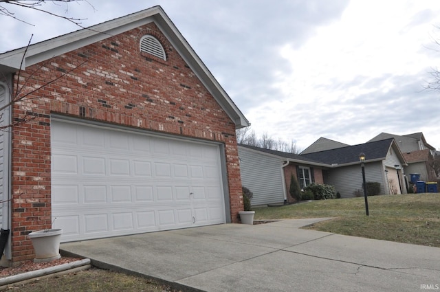 garage with concrete driveway