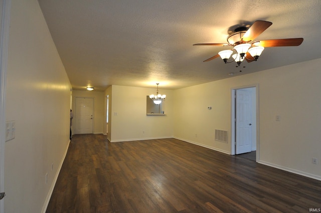 unfurnished room with dark wood-type flooring, ceiling fan with notable chandelier, and a textured ceiling