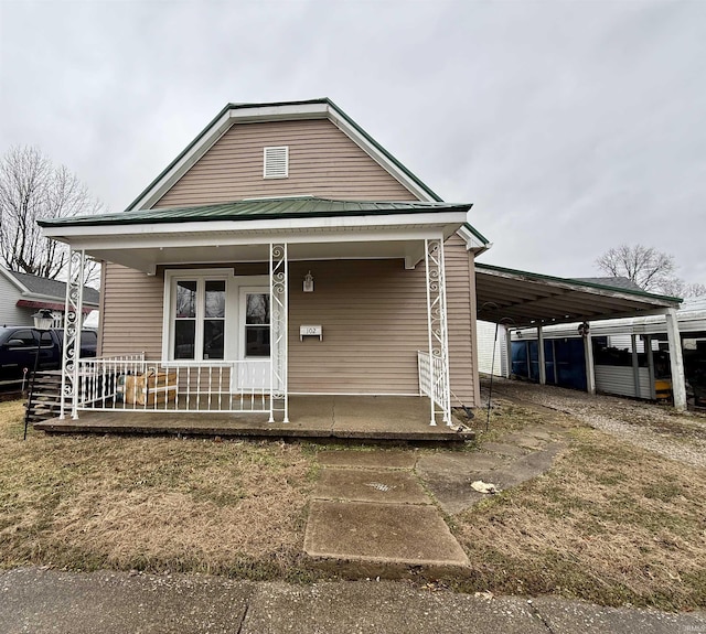 view of front of property with a carport and covered porch