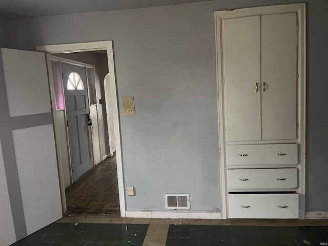 entryway with dark wood-type flooring