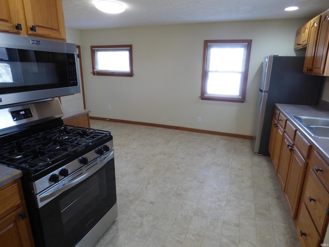 kitchen with appliances with stainless steel finishes and sink